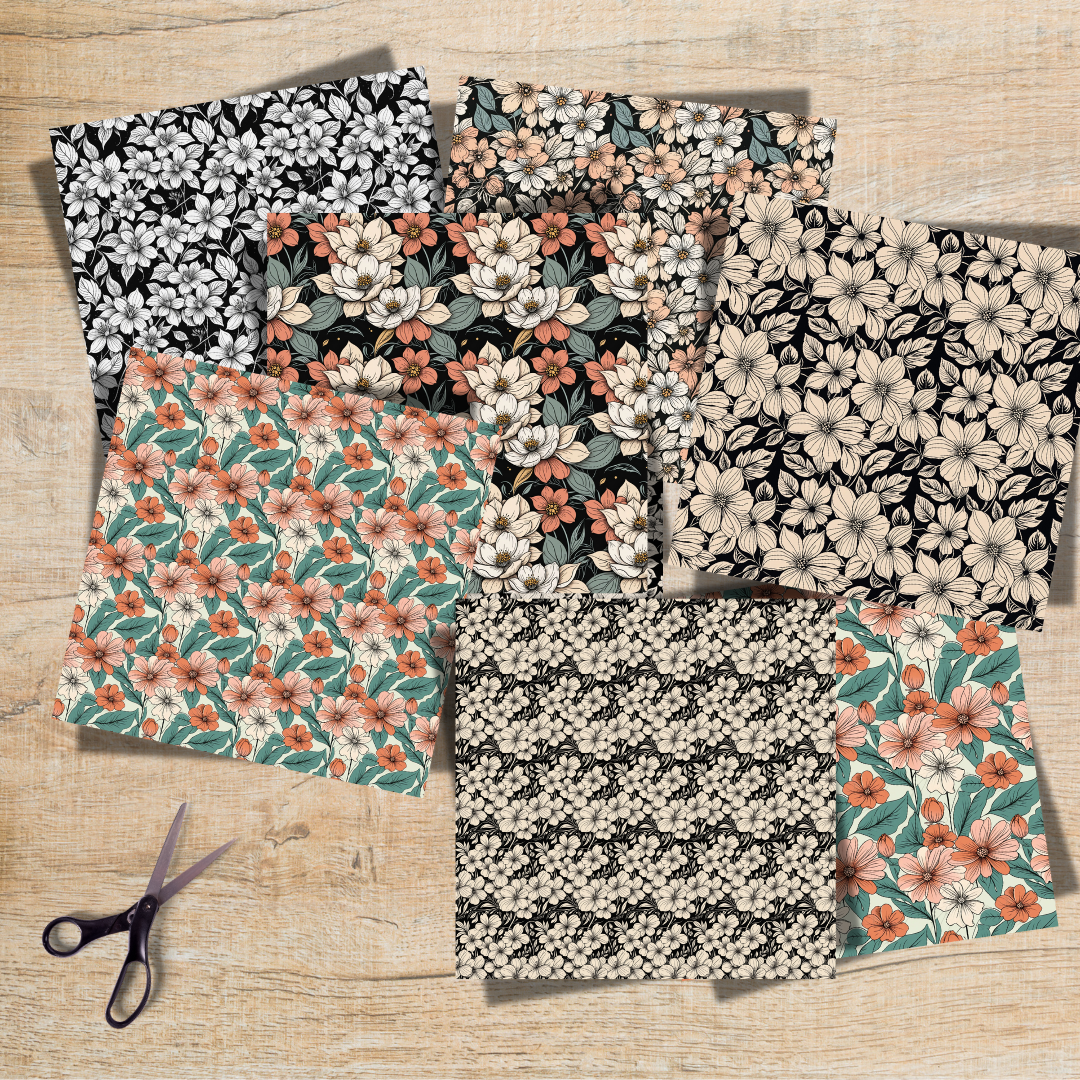 Vintage floral scrapbook paper designs in a variety of patterns and colors, displayed on a wooden background with scissors and crafting tools.